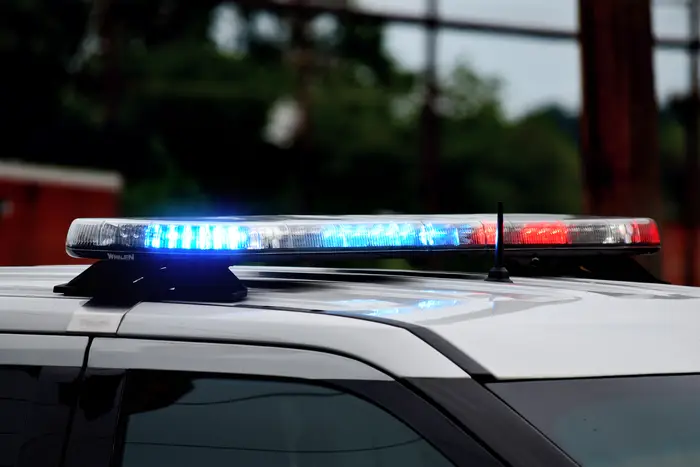 stock image of a police car's red and blue lights on the roof